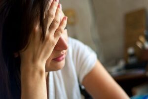 Stressed woman seeking guidance from a business coach.